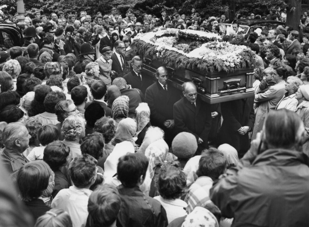 Crowds surround the coffin of Rolling Stones guitarist Brian Jones (1942 - 1969) at his funeral in Cheltenham, Gloucestershire, 10th July 1969